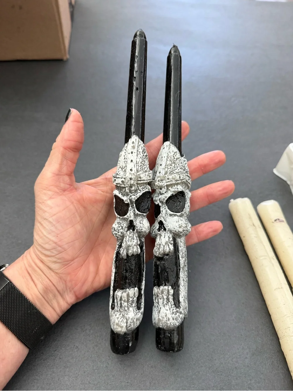 4 Halloween candles. 2 Black Skull and 2 spooky wood grain